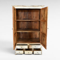 Chora Barefoot Luxury Living distressed white wood cupboard with open doors, showing rustic interior shelves and six drawers.