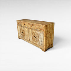 Chora Barefoot Luxury Living distressed wood sideboard with carved circular motifs on doors and 4 drawers.