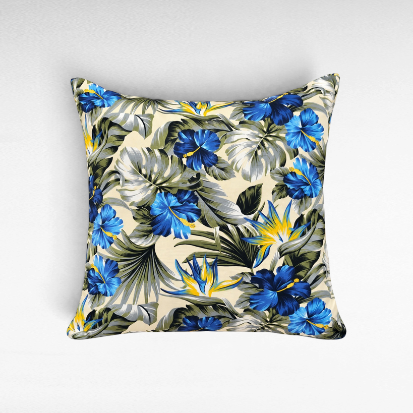 Chora Barefoot Luxury Living square cotton throw pillow featuring a vibrant blue hibiscus and tropical leaf print.