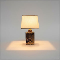 Chora Barefoot Luxury Living gold tiger table lamp with patterned base and cream shade.