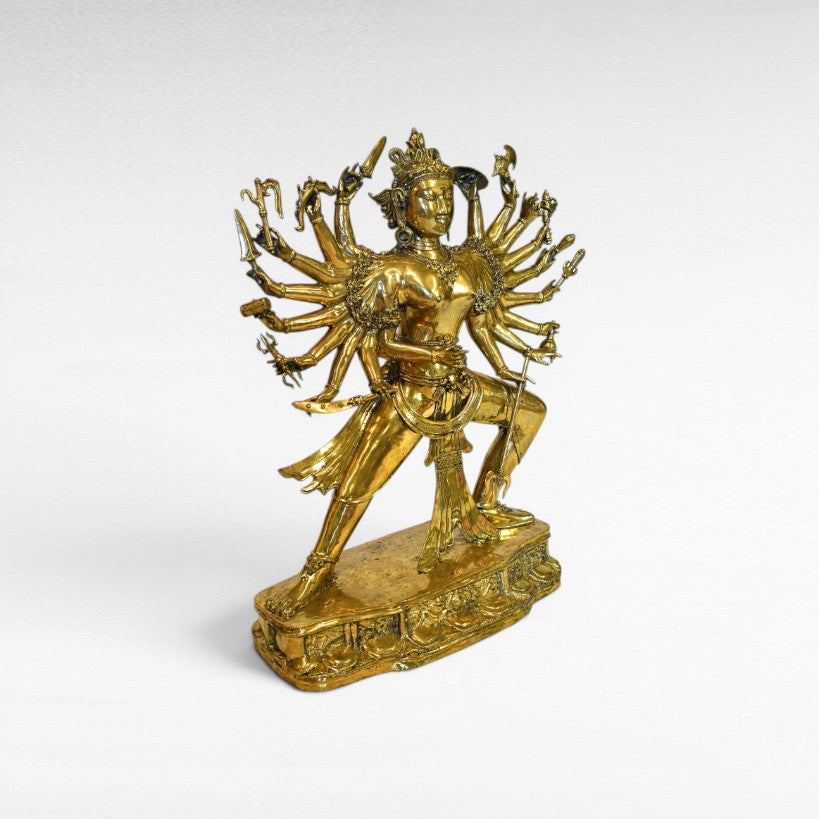 Chora Barefoot Luxury Living golden brass figurine of a multi-armed deity, W95 H120 cm.