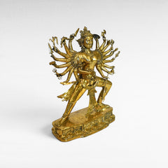 Chora Barefoot Luxury Living golden brass figurine of a multi-armed deity, W95 H120 cm.