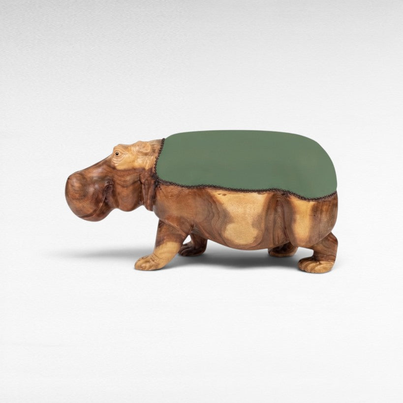 Chora Barefoot Luxury Living hippo stool carved from natural wood with a green upholstered seat and nailhead trim.
