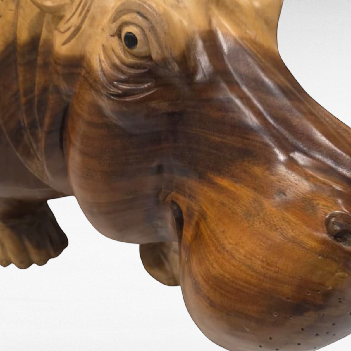 Chora Barefoot Luxury Living hippo stool carved from natural polished wood with detailed facial features