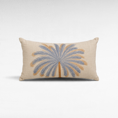 Chora Barefoot Luxury Living rectangular linen pillow featuring an embroidered blue and tan palm tree design.