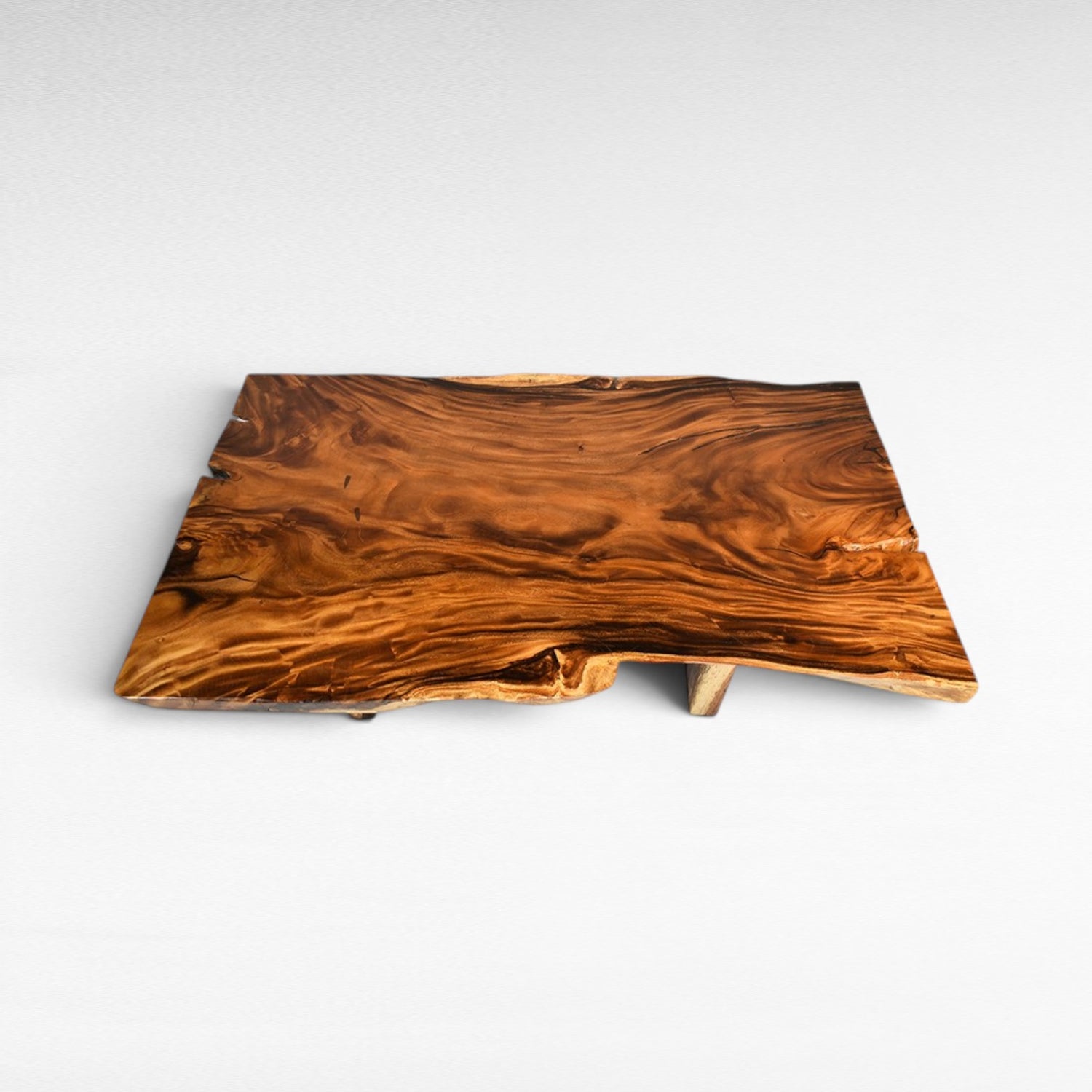 Chora Barefoot Luxury Living live edge dining table with natural wood grain and rich brown tones.