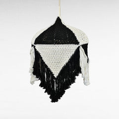Chora Barefoot Luxury Living handmade black and white macrame pendant light with fringe detail.