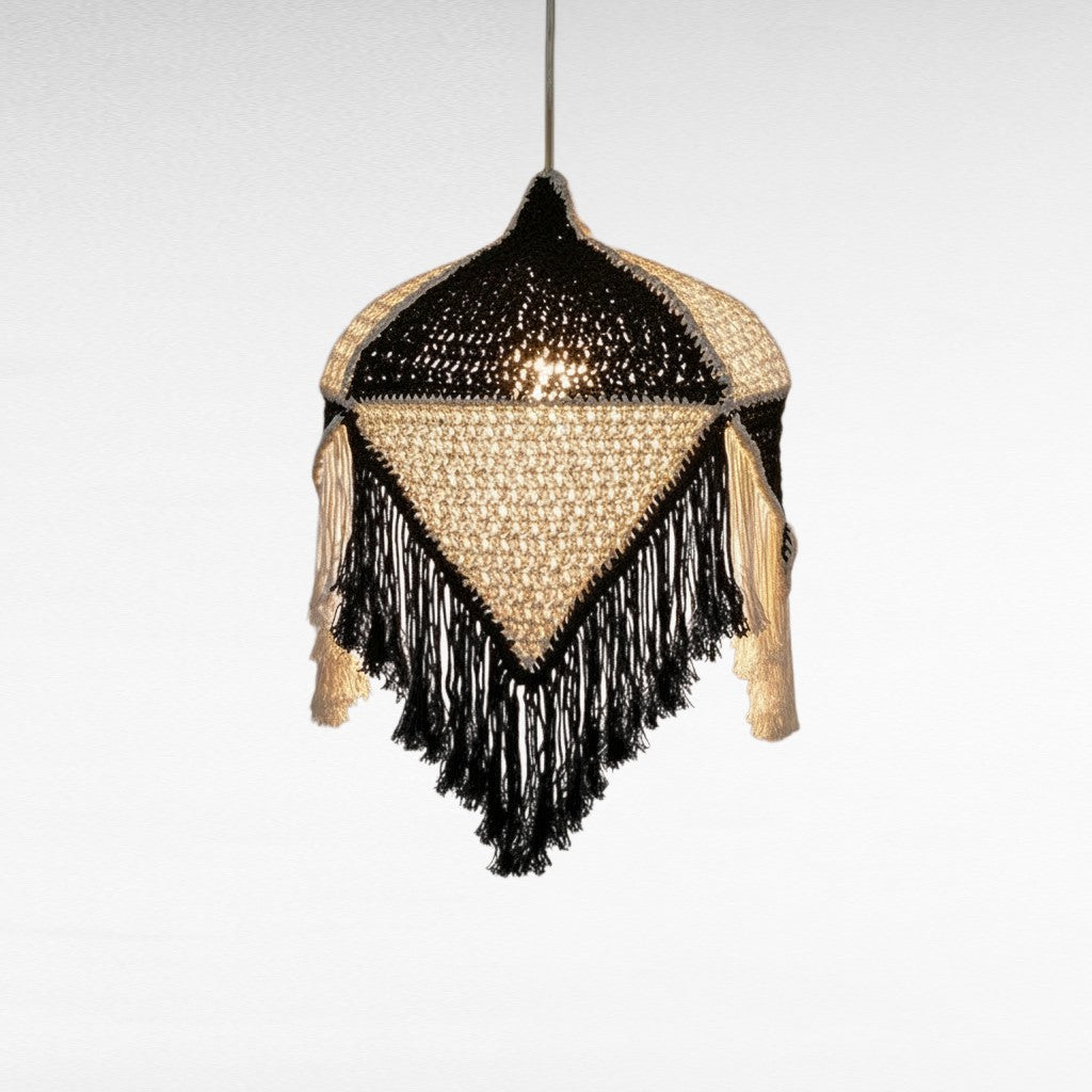 Chora Barefoot Luxury Living handmade black and white macrame pendant light with intricate fringe and geometric design
