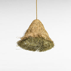 Chora Barefoot Luxury Living natural grass dome pendant lamp with a textured, layered weave in golden and green hues.