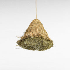 Chora Barefoot Luxury Living natural grass dome pendant lamp with a textured, layered weave in golden and green hues.