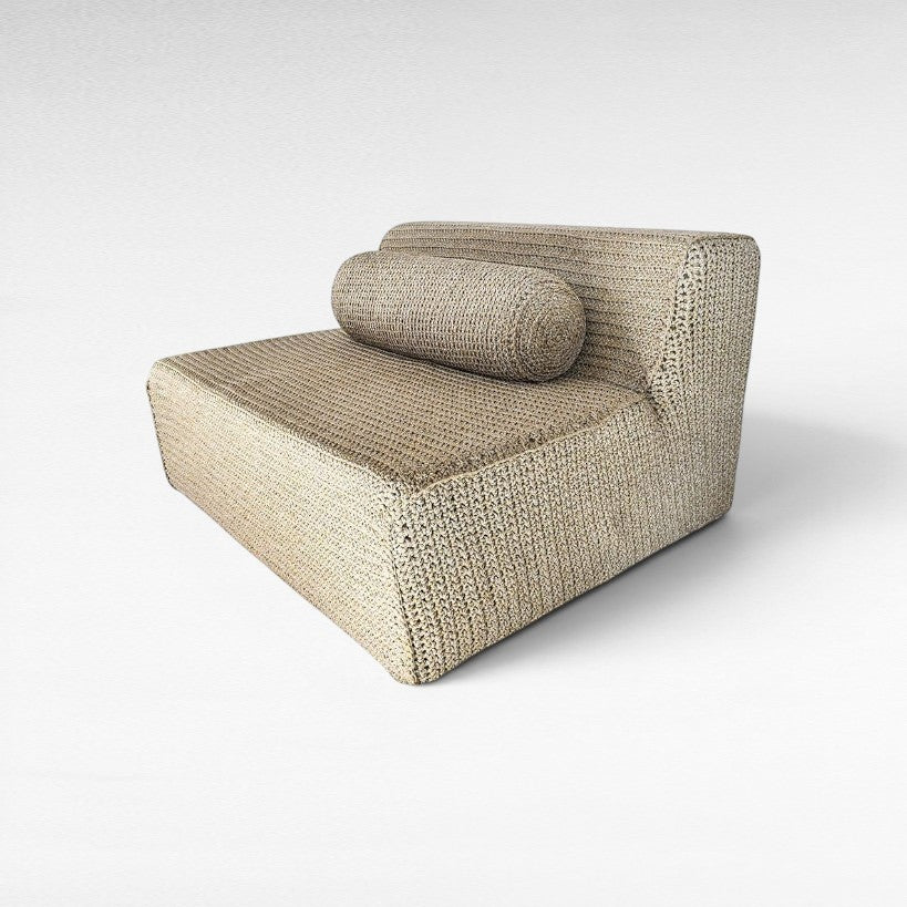 Chora Barefoot Luxury Living natural rope sofa with a cylindrical bolster cushion in a textured woven design