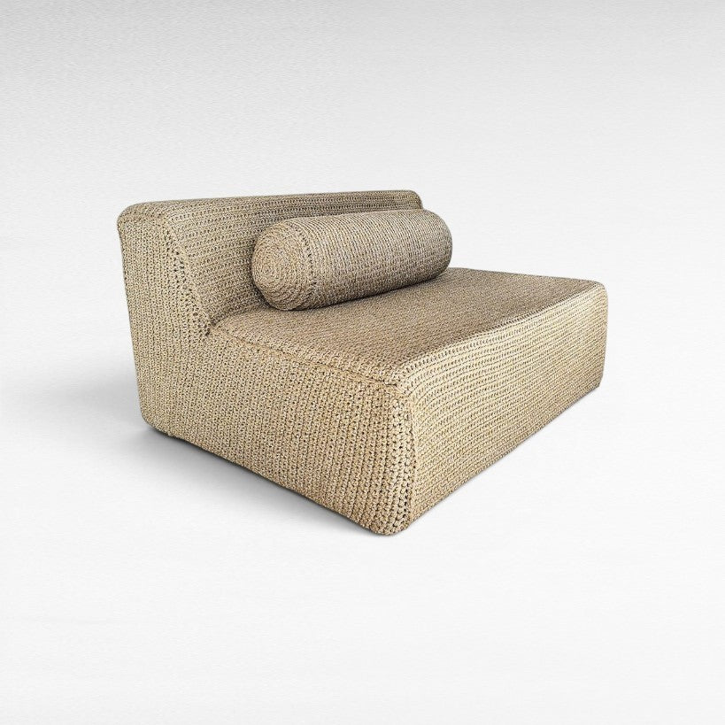 Chora Barefoot Luxury Living natural rope sofa with a cylindrical bolster pillow in a minimalist woven texture.