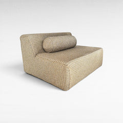 Chora Barefoot Luxury Living natural rope sofa with a cylindrical bolster pillow in a minimalist woven texture.