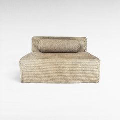 Chora Barefoot Luxury Living natural rope sofa with a low-profile design and matching cylindrical bolster cushion.