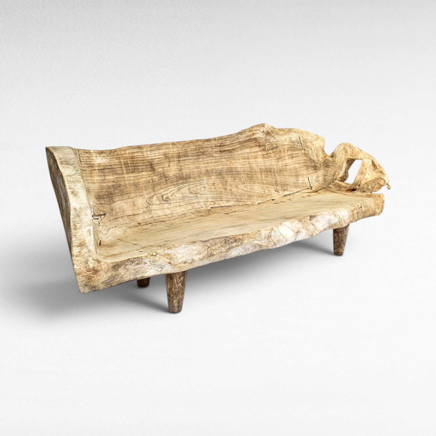 Chora Barefoot Luxury Living natural wood bench with unique live edge and carved details. Rustic sofa style.