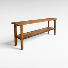 Chora Barefoot Luxury Living natural wood console table with a lower shelf and rustic minimalist design.