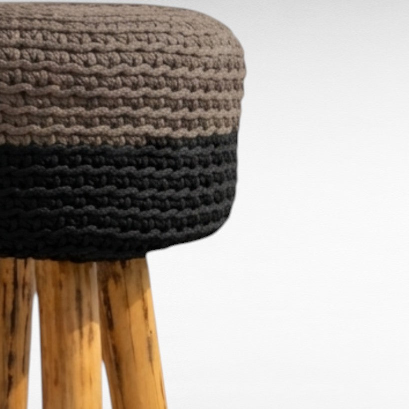 Chora Barefoot Luxury Living bar stool with natural oak wood legs and a two-tone brown and black woven rope seat.