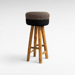Chora Barefoot Luxury Living bar stool with natural oak wood legs and a two-tone grey and black woven rope seat