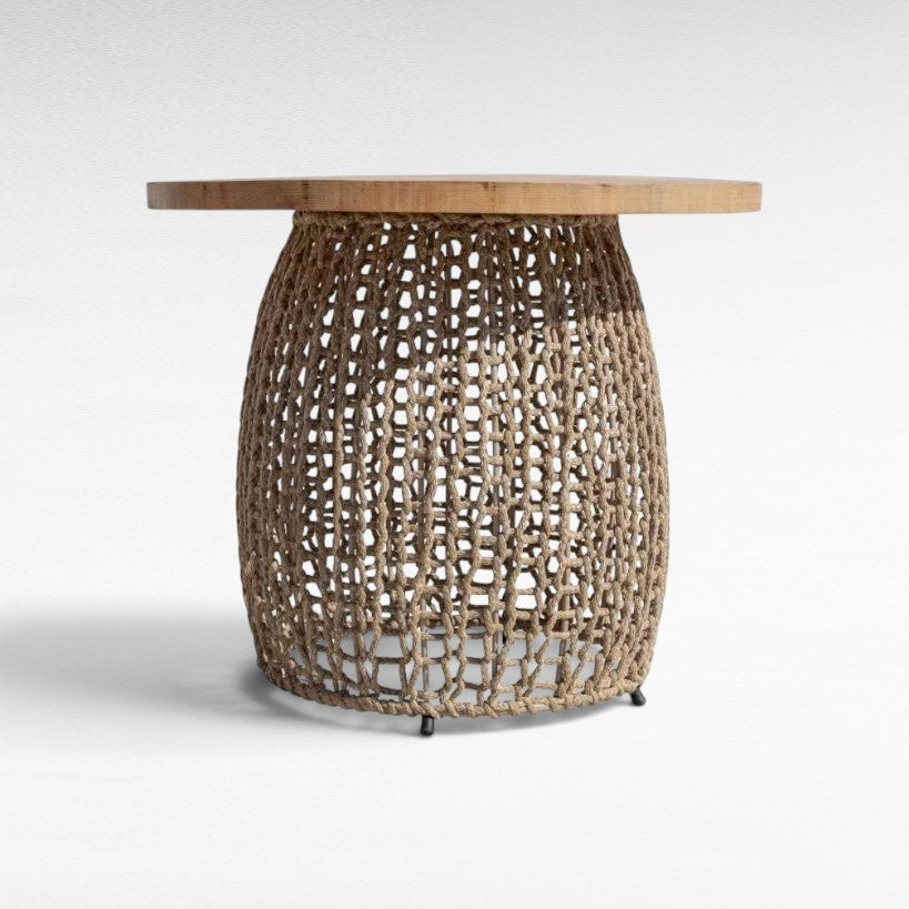 Chora Barefoot Luxury Living dining table with a round natural oak wood top and a hand-woven cotton rope base.