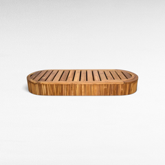 Chora Barefoot Luxury Living oval teak wood sunbed with slatted design for outdoor relaxation spaces.