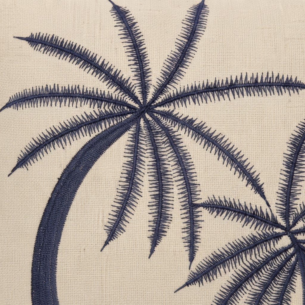 Chora Barefoot Luxury Living beige throw pillow with navy blue embroidered palm tree detail and hand-stitched edges