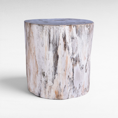 Chora Barefoot Luxury Living petrified wood stool with a natural white and grey textured finish on a white background