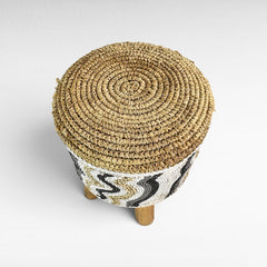 Chora Barefoot Luxury Living round stool with natural and white synthetic raffia woven top and patterned sides
