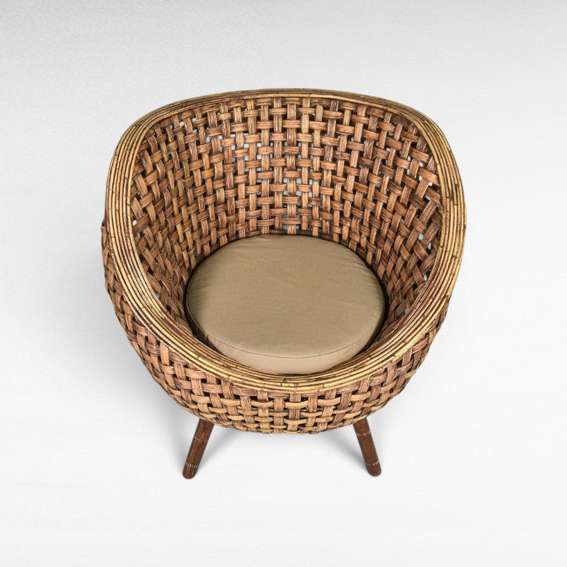 Chora Barefoot Luxury Living round rattan chair with tan cushion and wooden legs