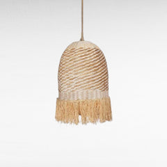 Chora Barefoot Luxury Living natural rattan and grass pendant light with white accents and fringe detail.