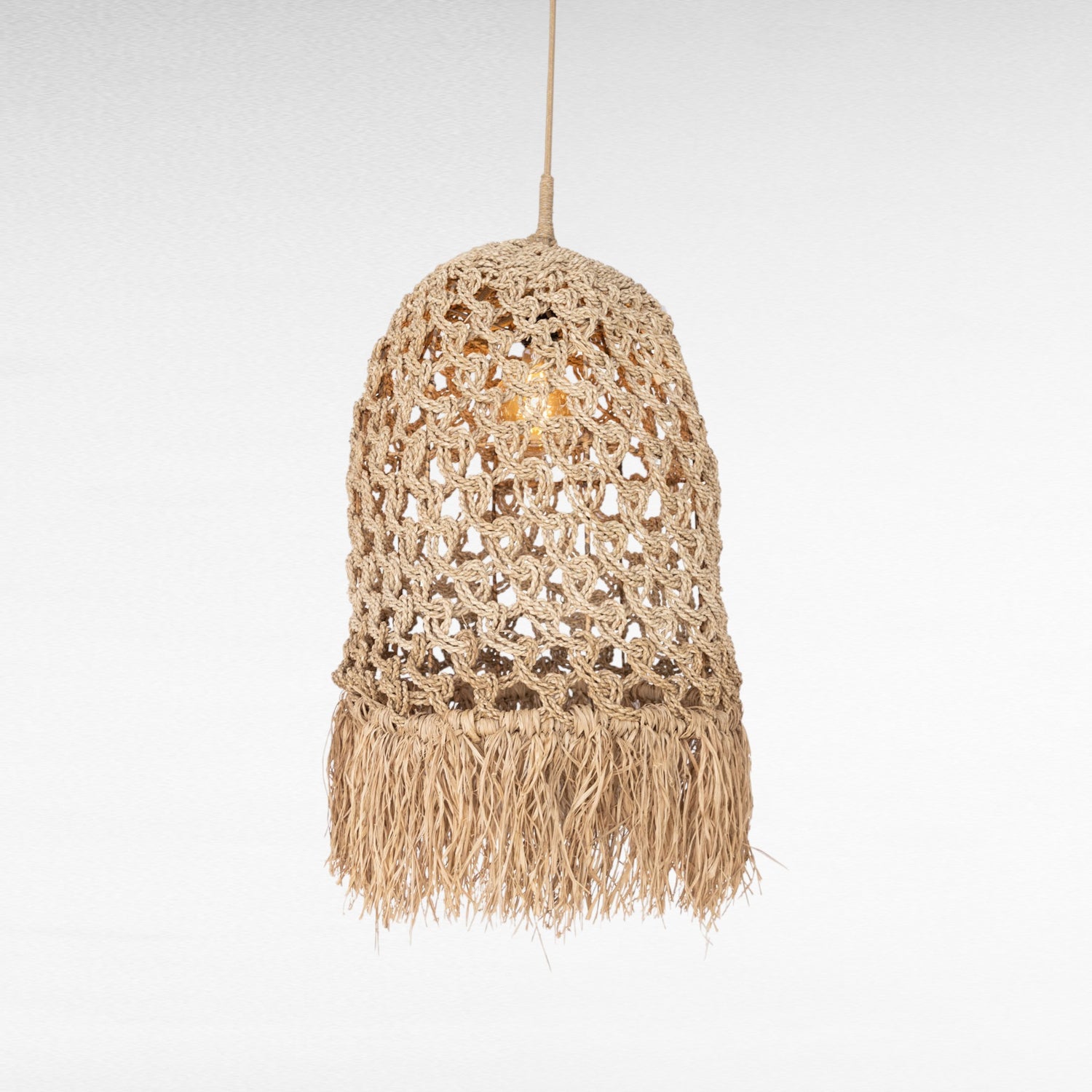 Chora Barefoot Luxury Living natural woven rattan and grass pendant light with fringe detail