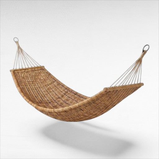Chora Barefoot Luxury Living woven rattan swinging hammock with sturdy rope suspension and natural wood spreader bars