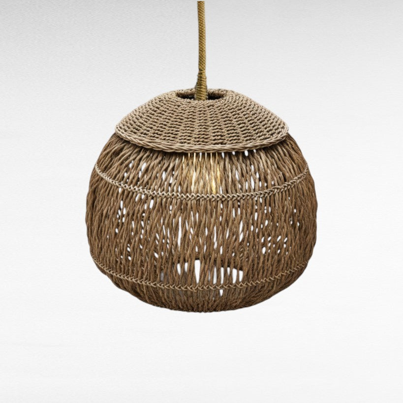 Chora Barefoot Luxury Living thick natural rattan pendant lamp with woven texture and ambient glow.