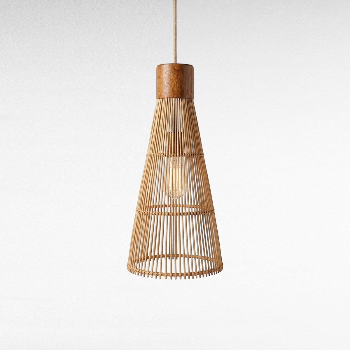Chora Barefoot Luxury Living conical pendant light, natural rattan and teak wood, 55cm H x 25cm W, with visible bulb.
