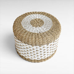Chora Barefoot Luxury Living round synthetic rattan stool in natural and white with a woven textured pattern.