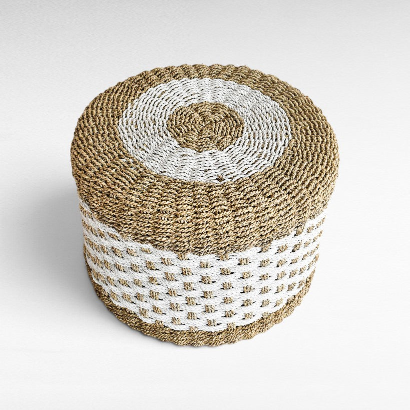 Chora Barefoot Luxury Living round synthetic rattan stool in natural and white woven pattern