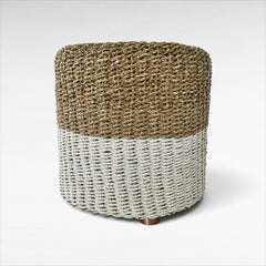 Chora Barefoot Luxury Living round stool made of natural and white synthetic rattan with a woven textured finish