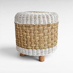 Chora Barefoot Luxury Living round stool featuring natural and white woven synthetic rattan with wooden legs.
