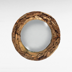 Chora Barefoot Luxury Living round mirror featuring a rustic frame made from textured recycled teak wood pieces.