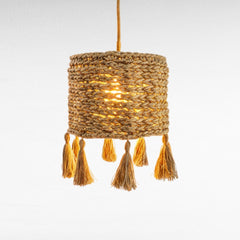 Chora Barefoot Luxury Living natural cream cotton rope pendant lamp with braided texture and tassels.