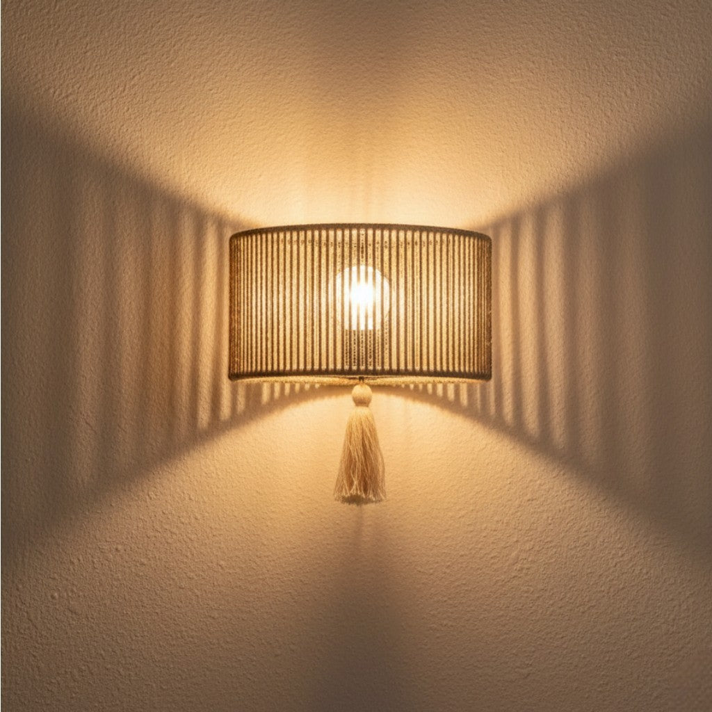 Chora Barefoot Luxury Living natural rope and metal frame wall lamp with tassel detail, 33cm wide.