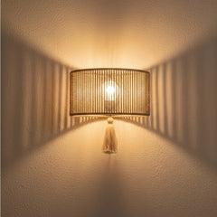 Chora Barefoot Luxury Living natural rope and metal frame wall lamp with tassel detail, 33cm wide.