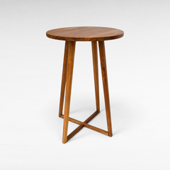Chora Barefoot Luxury Living round wooden bar table with a minimalist design and cross-base legs for modern interiors.