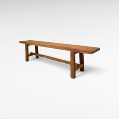 Chora Barefoot Luxury Living rustic teak wood bench with a natural grain finish and sturdy rectangular frame