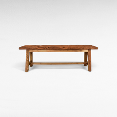 Chora Barefoot Luxury Living rustic solid teak wood bench with a distressed finish and organic grain patterns.