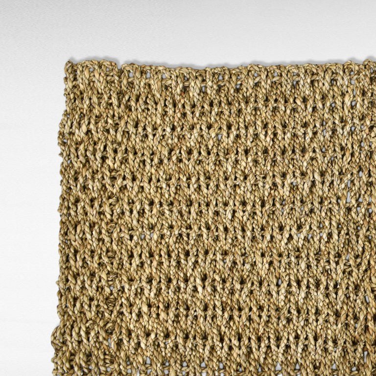 Chora Barefoot Luxury Living woven natural seagrass mat, 40 cm diameter, with a textured open-weave pattern.