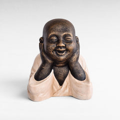 Chora Barefoot Luxury Living Figurine Shaolin, a laughing Buddha statue made of fiber cement in bronze and cream colors.