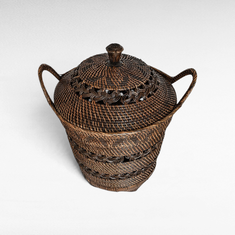 Chora Barefoot Luxury Living small dark brown woven rattan basket with a lid and decorative braided handle details