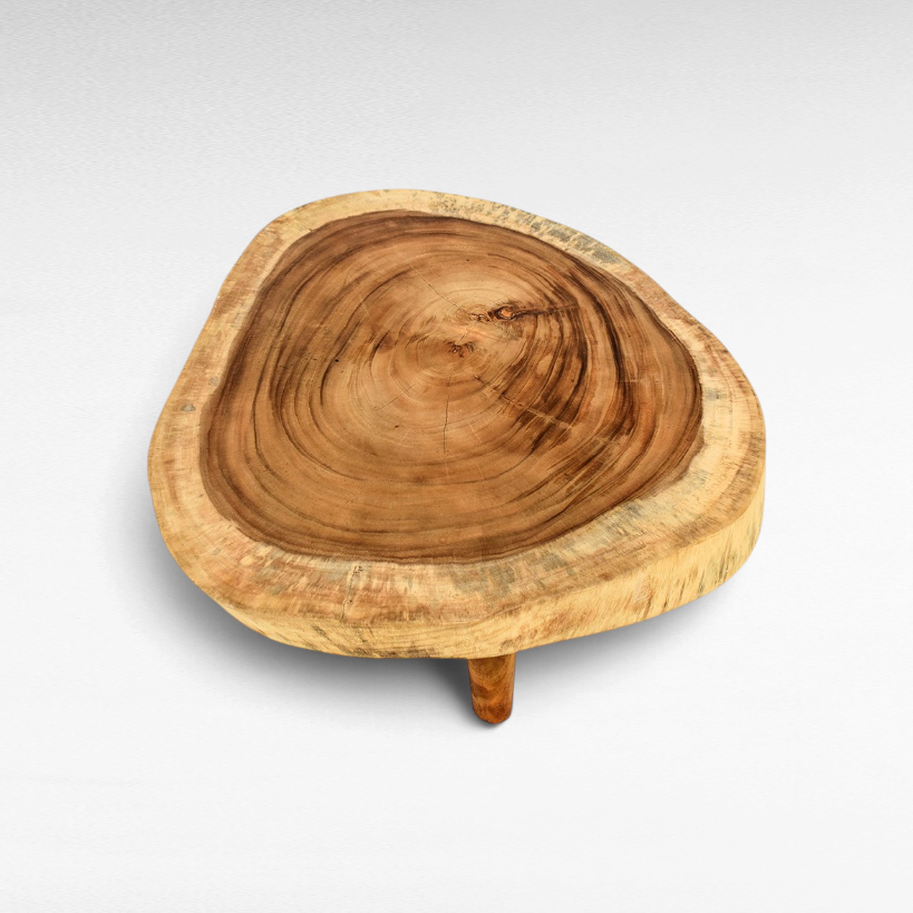 Chora Barefoot Luxury Living suar wood coffee table with a natural slab top and distinctive grain patterns