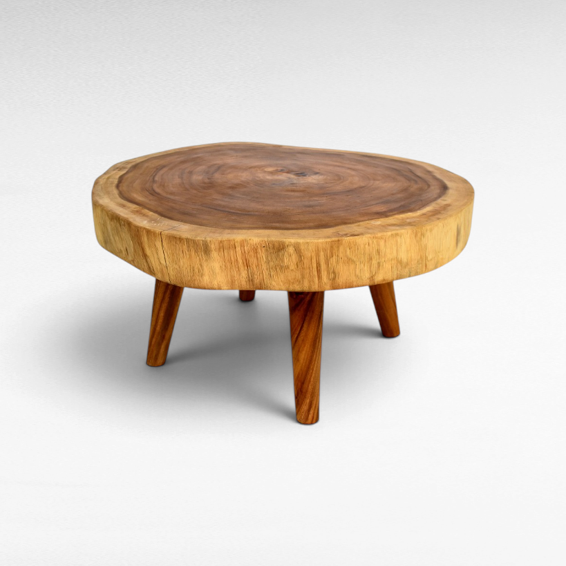Chora Barefoot Luxury Living circular suar wood coffee table with natural live edge grain and tapered wooden legs