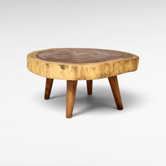 Chora Barefoot Luxury Living circular suar wood coffee table with natural grain and sturdy wooden legs